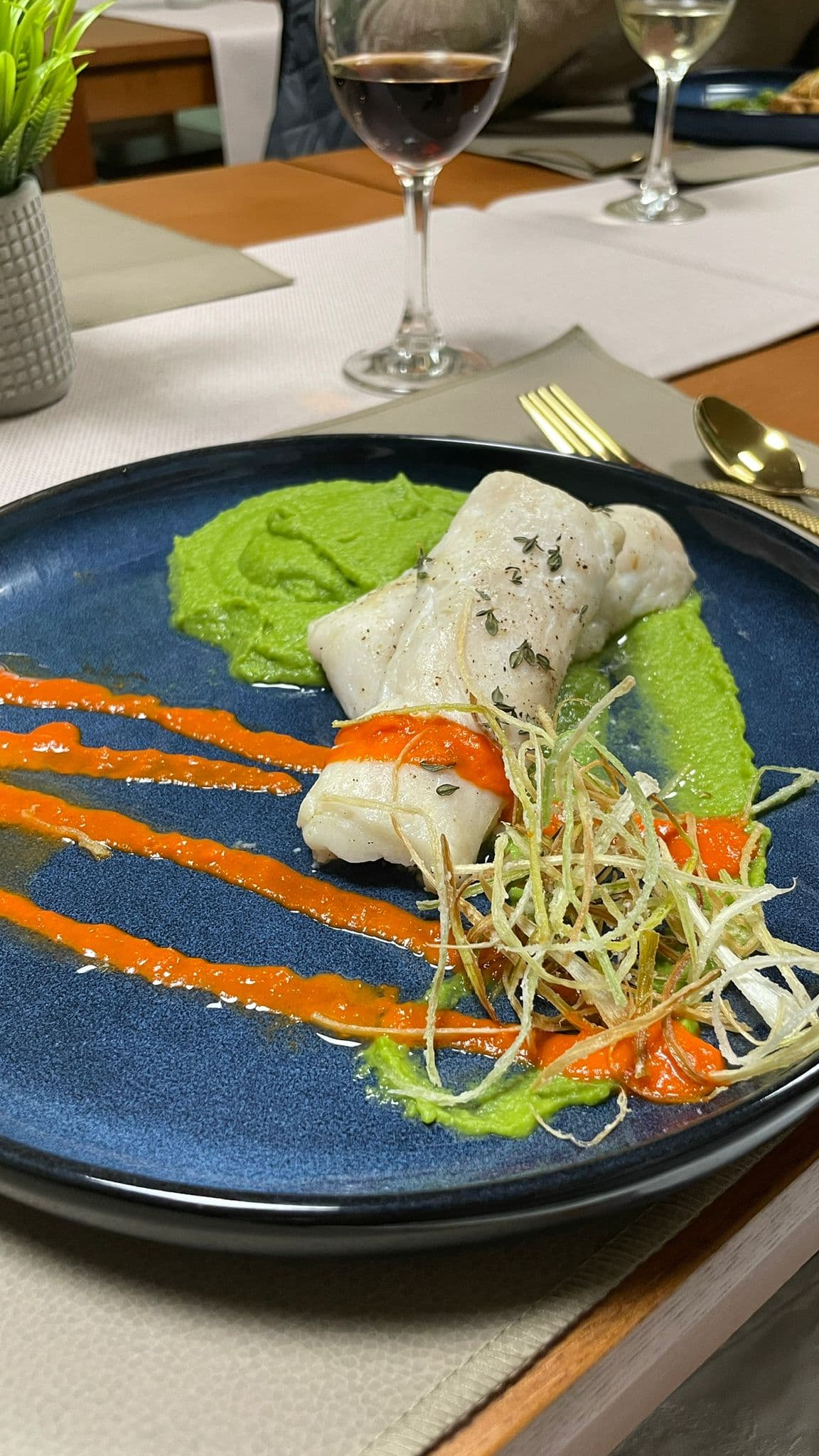 Roasted hake with pea purée and pepper emulsion